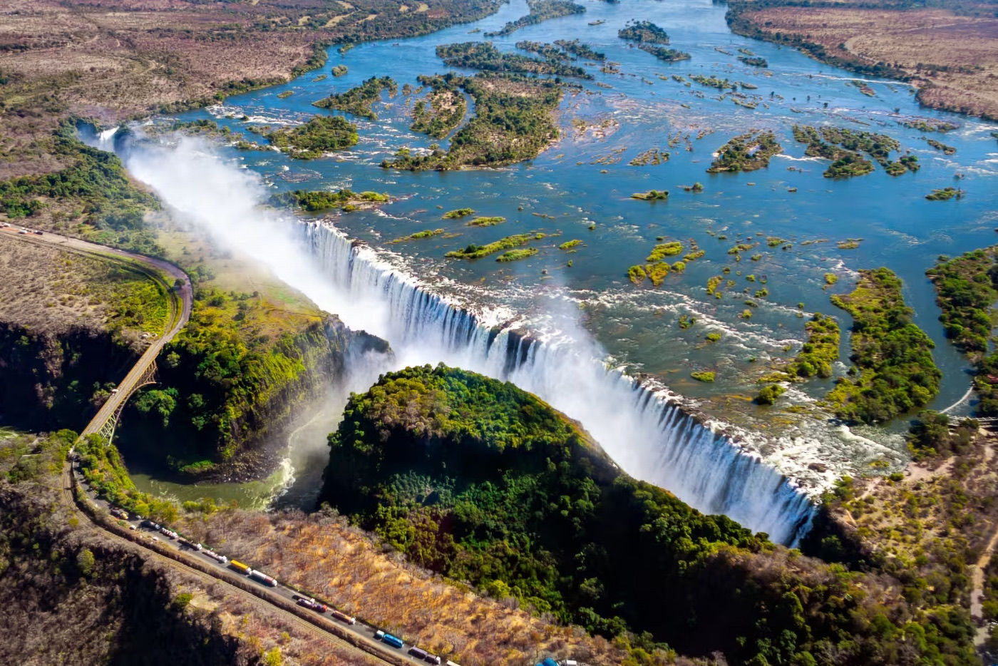 Victoria Falls from the air, spray rising out of the gorge