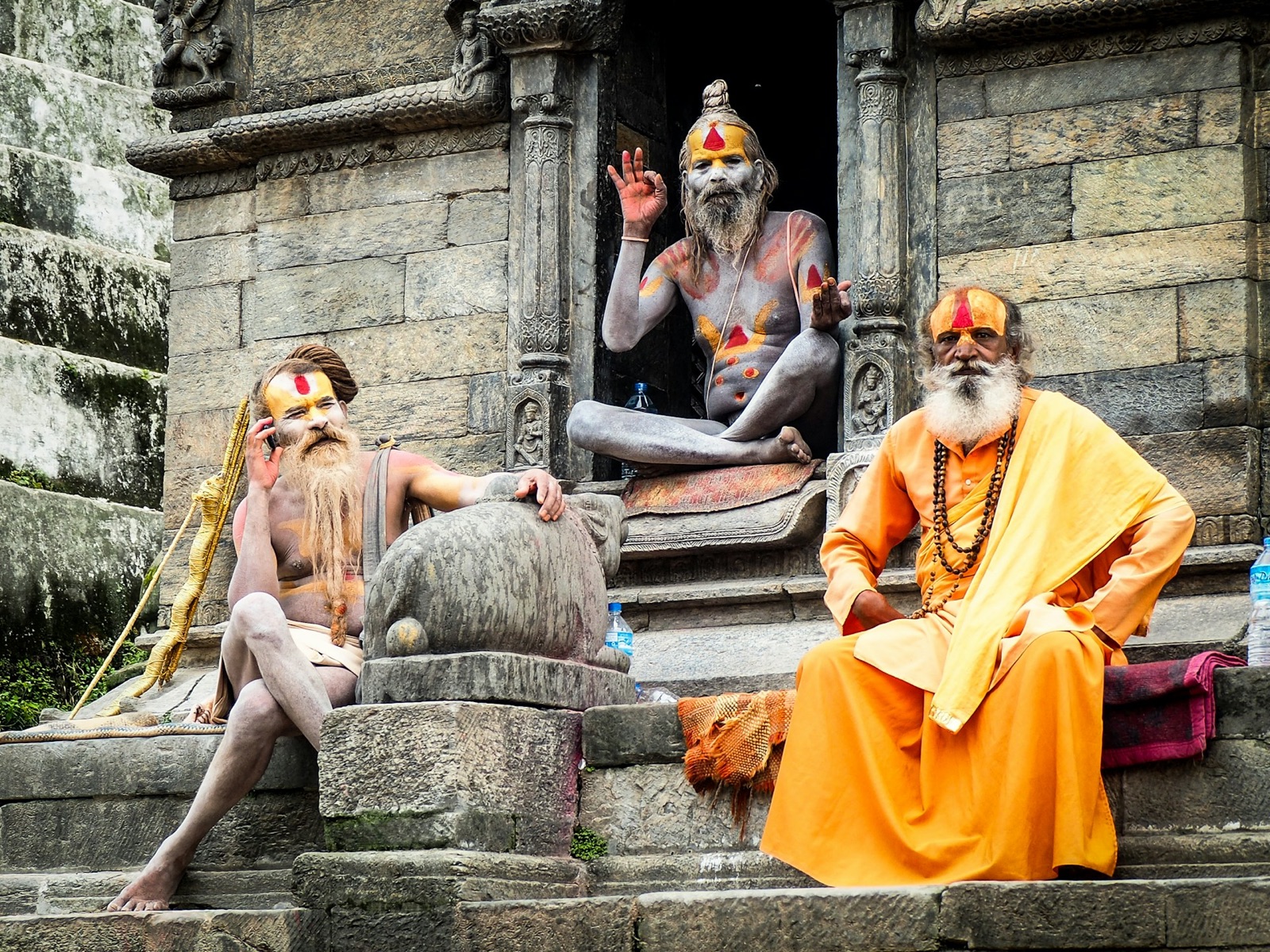 Sadhus sitting on temple steps in Kathmandu