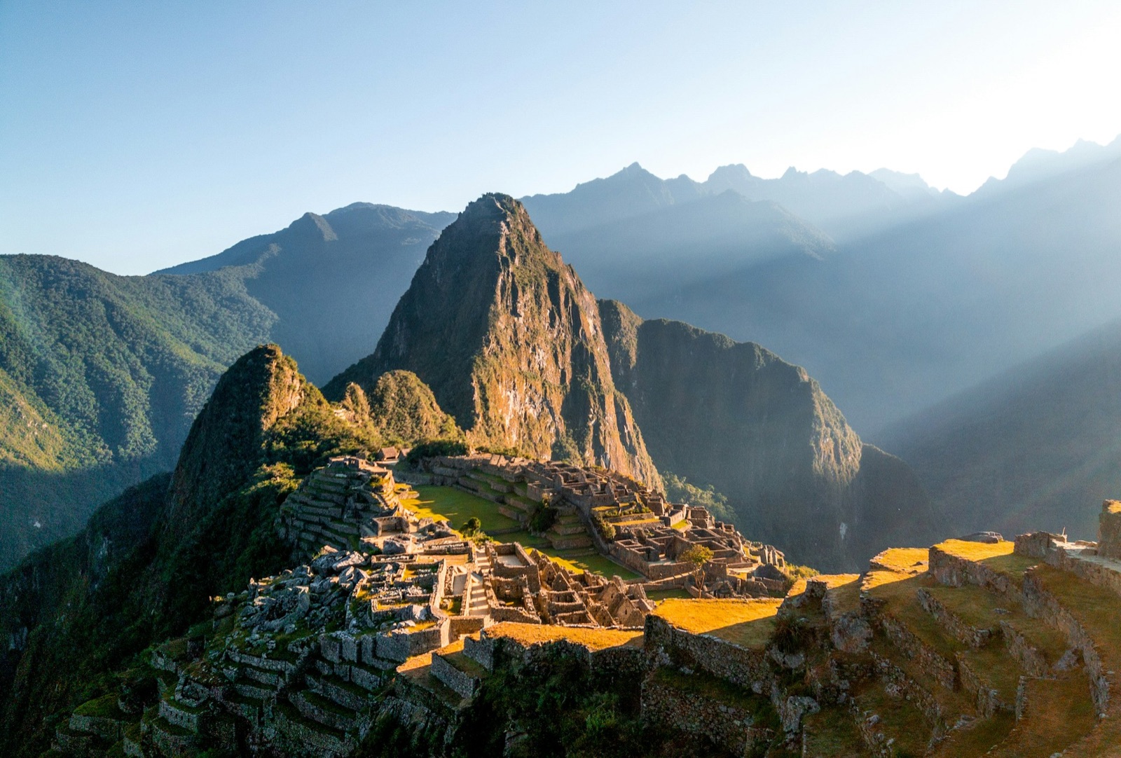 Machu Picchu at first light with the Andes behind it