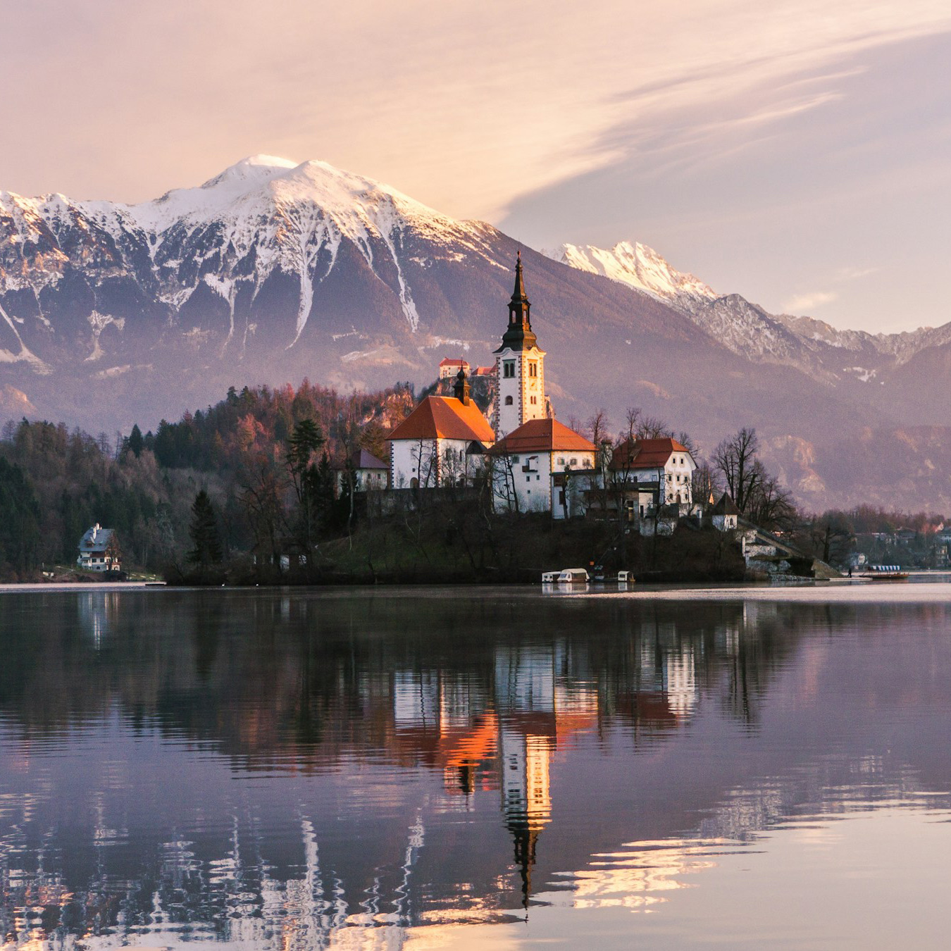 The island church on Lake Bled with the Julian Alps behind it